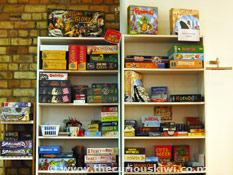 Shelves of games at Cakes n Ladders
